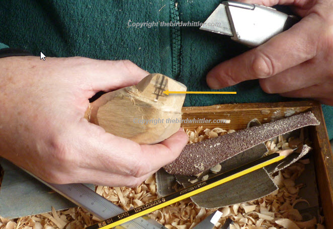 Show approx where the beak will be when wood is when whittler away. 