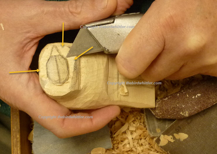 Knife removing the wood.